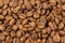 Coffee beans background, texture, pattern. Pile of coffee