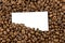 Coffee beans with a blank bussines card