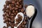 Coffee beans, brown sugar and teaspoons