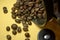 Coffee beans on bucket on yellow background