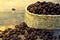 Coffee beans in bulk on wood table and a soft light