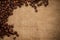 Coffee beans on burlap background