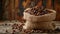 Coffee beans in a burlap bag on a wooden background