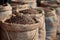 Coffee beans in a burlap bags Ai photo