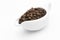 Coffee beans in a ceramic milk jug