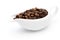 Coffee beans in a ceramic milk jug