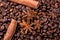 Coffee beans and cinnamon on a background of burlap. ,