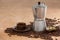 Coffee beans, coffee, coffeemaker and scoop