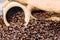 Coffee beans in a decorative bucket on a coffee beans background