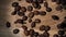 Coffee beans falling on the wood table