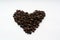 Coffee beans in heart form on white