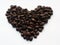 Coffee beans in heart form on white