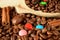 Coffee beans, multicoloured drops, cinnamon and vanilla