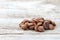 Coffee beans on a old wooden background. Roast coffee beans on white wooden table. Coffee grains. Copy space