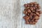 Coffee beans on a old wooden background. Roast coffee beans on white wooden table. Coffee grains. Copy space