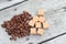 Coffee beans on a old wooden background. Roast coffee beans on white wooden table. Coffee grains. Copy space