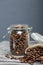 Coffee beans. Poured into a drag bag jar and linen bag. Close-up shot