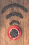 Coffee beans in red cup on old wooden table with copyspace. Coffee beans are arranged in the symbol wifi