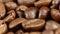 Coffee beans in rotate perfectly on a turntable. Close up. Rotating