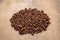 Coffee beans on a rough cloth on the table