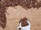 Coffee beans on sackcloth white cup
