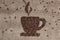 Coffee beans shaping cup on burlap