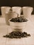 Coffee beans in stainless steel pot faded sepia