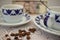 coffee beans on the table with coffee cups and dollar bill