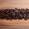 coffee beans top view. Roasted coffee beans on wooden table. Beautiful texture of coffee beans