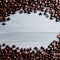 coffee beans top view. Roasted coffee beans on wooden table. Beautiful texture of coffee beans