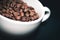 Coffee beans in white cup