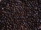 Coffee beans on wood background, organic coffee seed