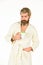 Coffee in bed. guy drink coffee. brutal bearded hipster isolated on white. cozy and comfortable. man in bathrobe after