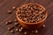 Coffee bens bowl on wooden background