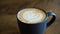 Coffee break. Cappuccino cream art. Breakfast beverage at eco mug.