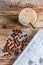 Coffee break with cold iced latte and beans on wooden table background top view