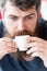 Coffee break concept. Hipster drinking coffee close up. Caffeine recharge. Man with beard and mustache and cup of coffee