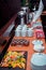 Coffee break served on the table â€“ pieces of chocolate cake on black stone tray, fruits and tea-cups