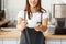 Coffee business concept - caucasian female serving coffee while standing in coffee shop. focus on female hands placing a