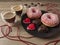 coffee and candles behind a plate with donuts and heart-shaped cookies