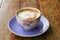 Coffee cappuccino closeup on wooden table