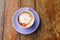 Coffee cappuccino closeup on wooden table