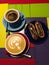 Coffee cappuccino with eclairs on the table