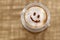 Coffee cappuccino with foam or chocolate smiling welcome happy face