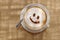 Coffee cappuccino with foam or chocolate smiling welcome happy face