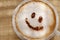 Coffee cappuccino with foam or chocolate smiling welcome happy face