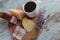 Coffee, cheese and meat on a wooden stand on the table.