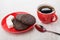 Coffee, chocolate cookies with airy rice, sugar cubes, spoon