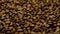 Coffee close up. roasted coffee beans. Coffee beans factory mixing. Macro shot of coffee beans.