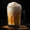 Coffee cocktail with cream and ice. Latte with orange topping. Splash of drink on a plain background.
